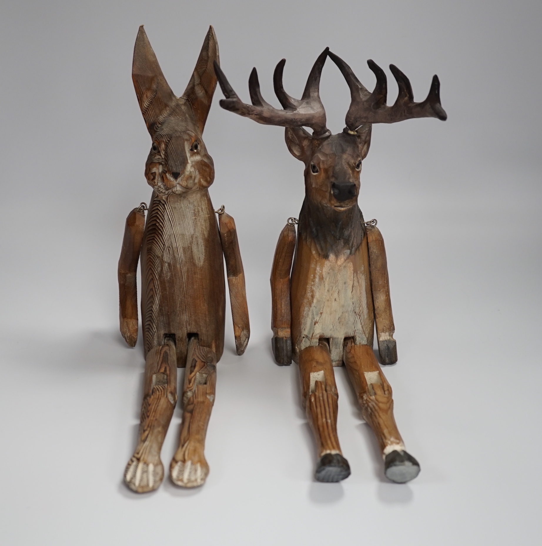 A of novelty jointed carved wooden Deer and similar Hare - 43cm